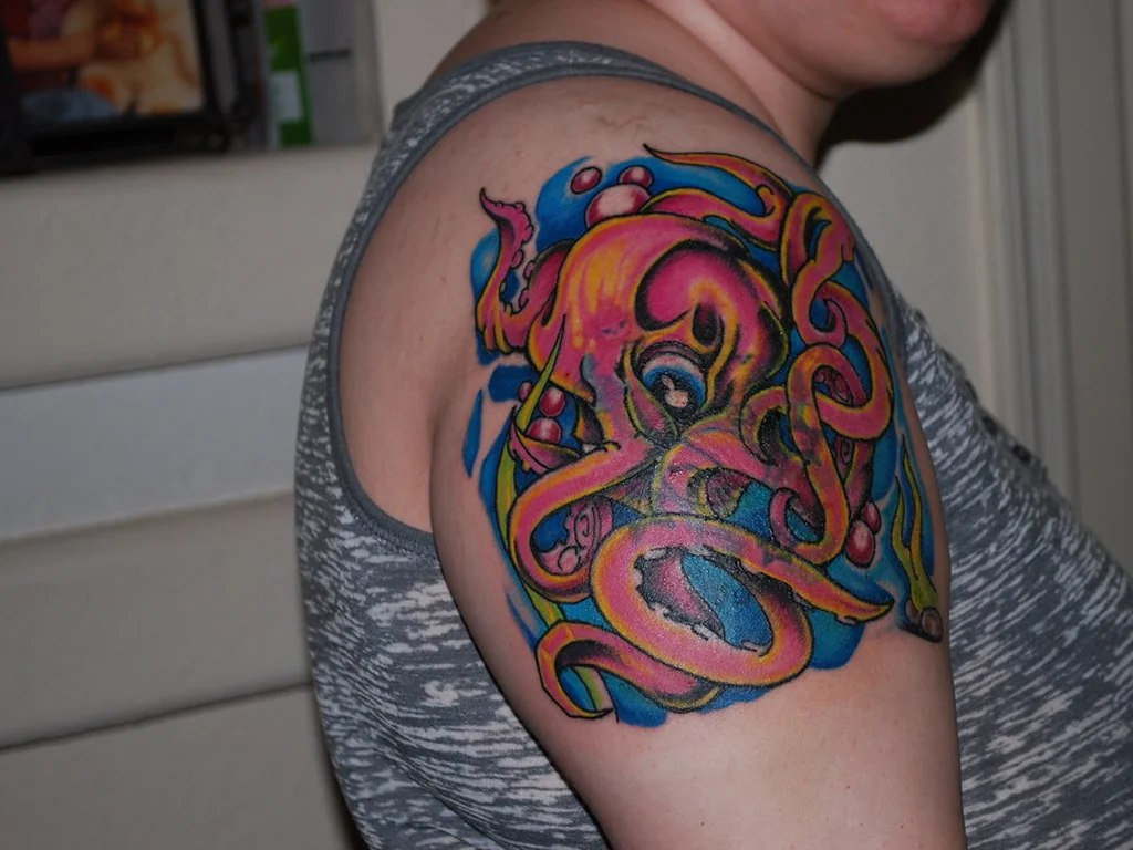 50 Animal Tattoo Ideas: The Complete Guide by Animal, Style and Placement 47 Bright psychedelic colour octopus tattoo on a shoulder