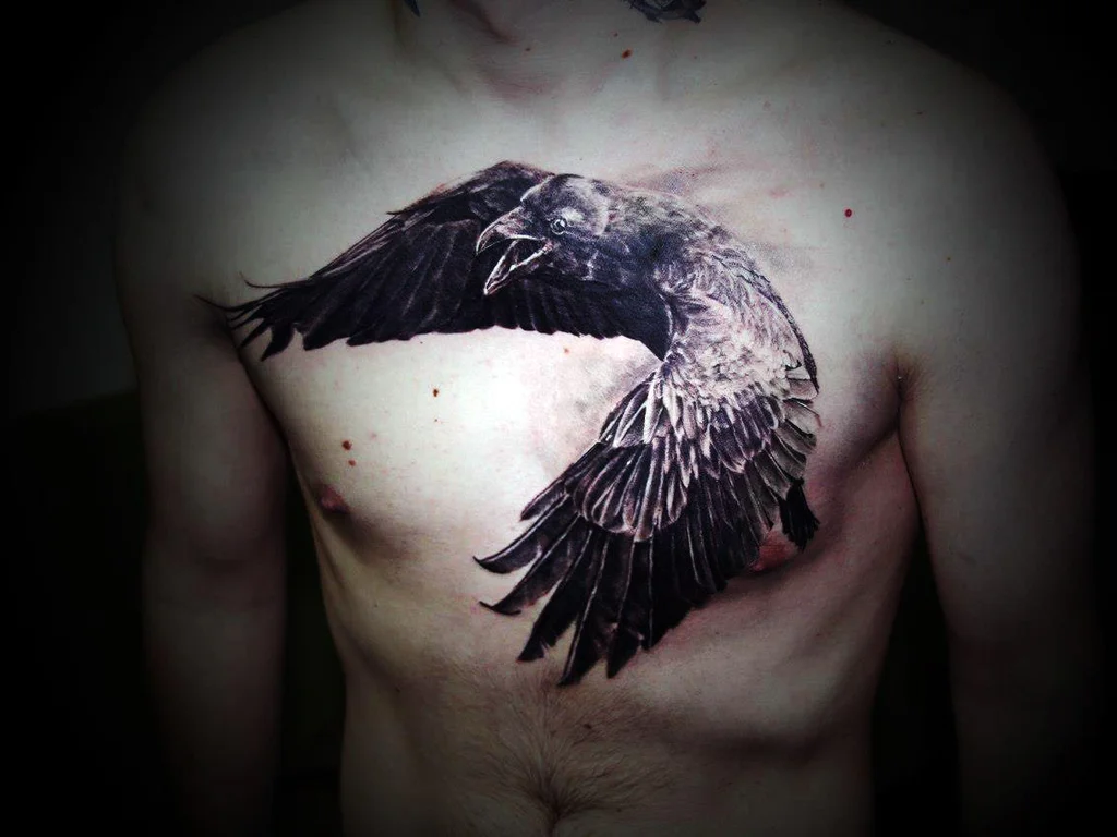 35 Bird Tattoo Ideas: Meanings, Species and Best Placements 28 Large black crow tattoo across a chest