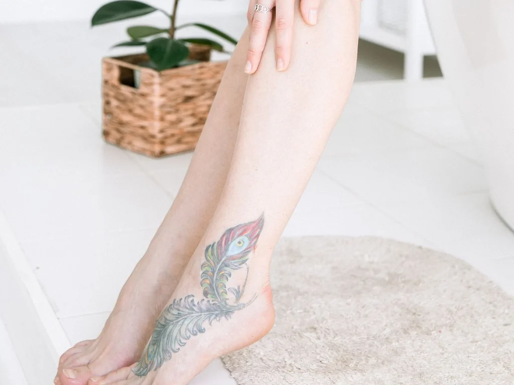 35 Bird Tattoo Ideas: Meanings, Species and Best Placements 35 Peacock feather tattoo on the top of a foot
