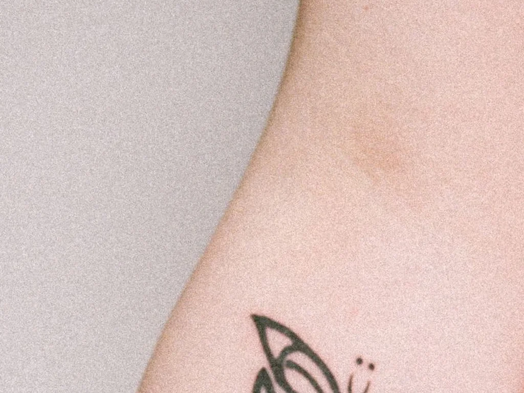 22 Butterfly Tattoo Ideas: Meanings, Styles and Best Placements 3 Ornamental fine-line butterfly tattoo on a forearm