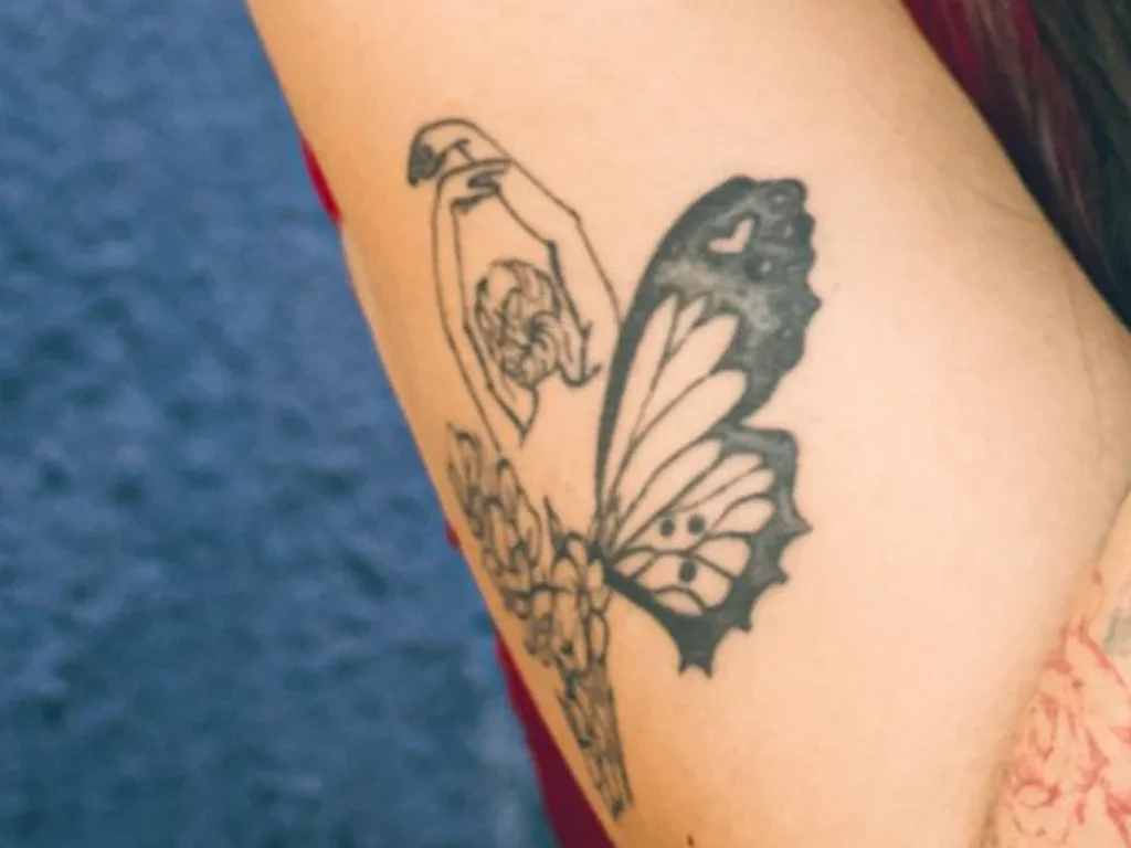 22 Butterfly Tattoo Ideas: Meanings, Styles and Best Placements 8 Half butterfly half flower tattoo on a forearm