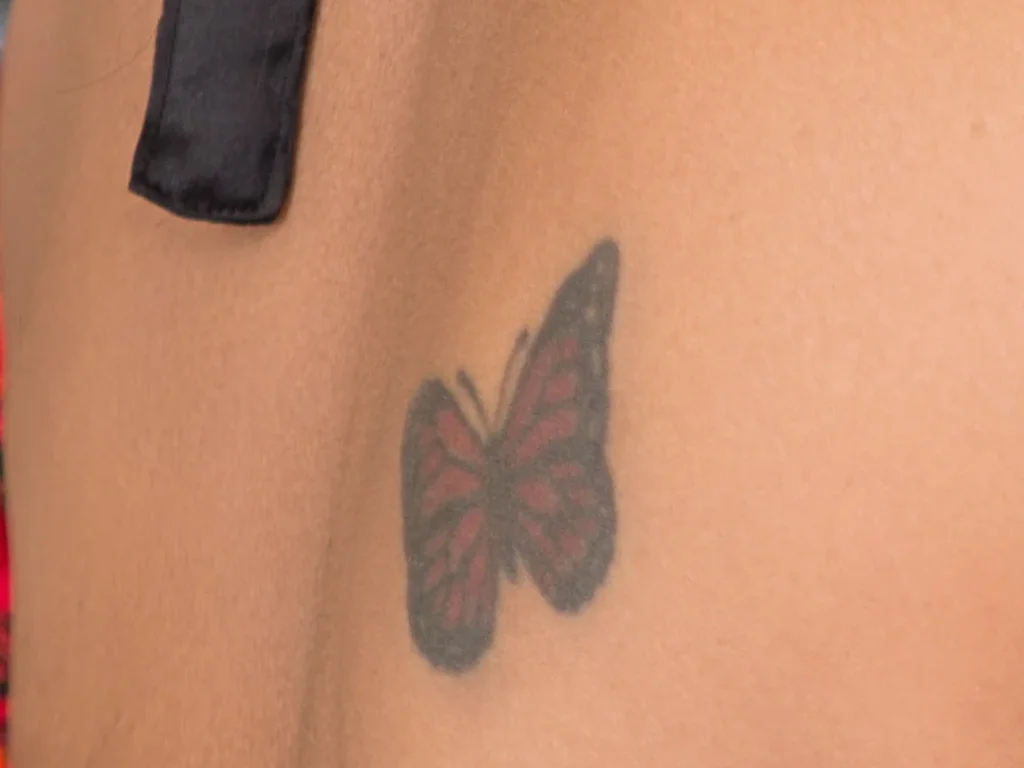 22 Butterfly Tattoo Ideas: Meanings, Styles and Best Placements 15 Small butterfly tattoo on the upper back