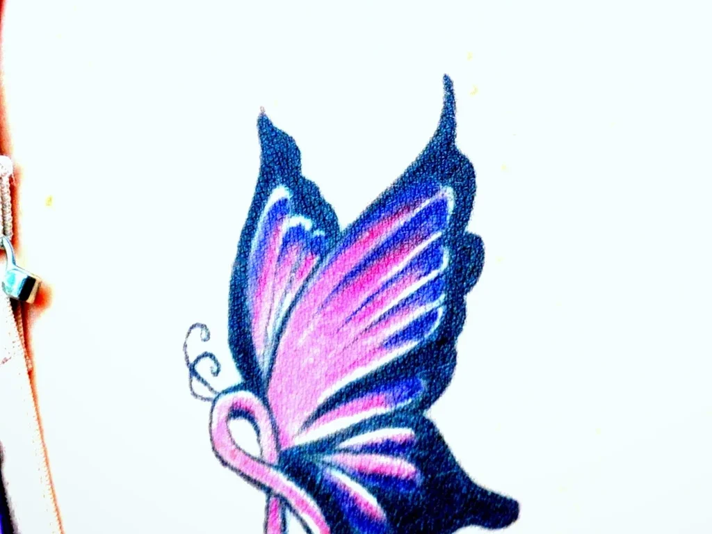22 Butterfly Tattoo Ideas: Meanings, Styles and Best Placements 19 Purple and pink butterfly tattoo on a shoulder blade