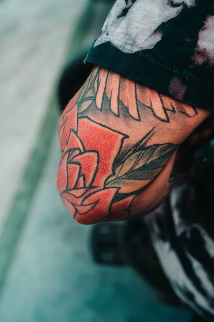 Flower Tattoo Design Ideas — Meanings, Styles and Placements for 15 Flowers 24 Colourful floral tattoo with detailed petals on a woman's arm