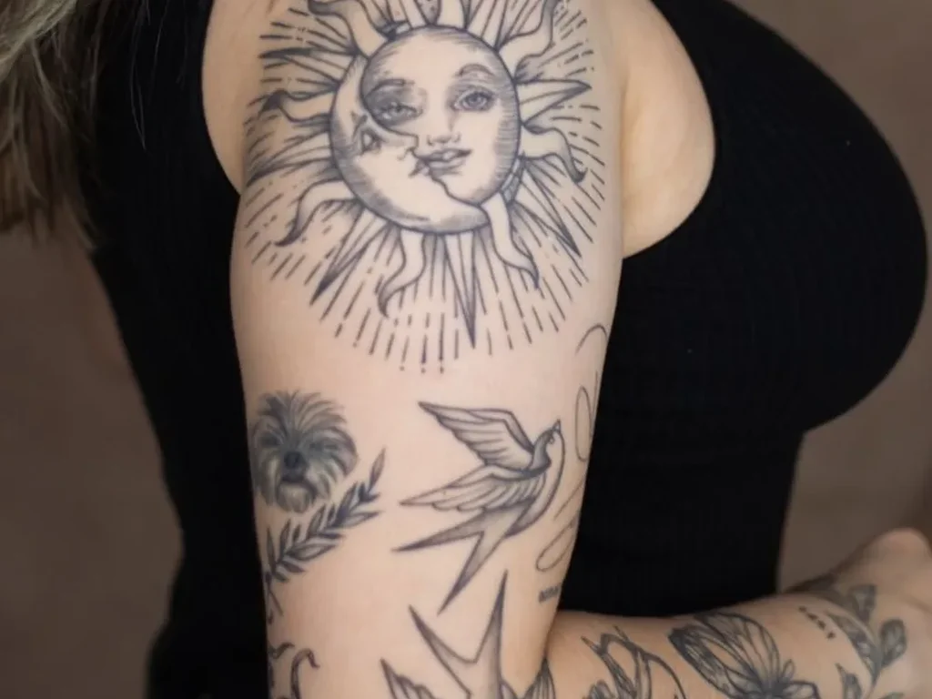25 Fine Line Tattoo Ideas: Delicate Designs, Honestly Rated 6 Fine line sun and moon face tattoo with radiating lines on an upper arm, swallows below