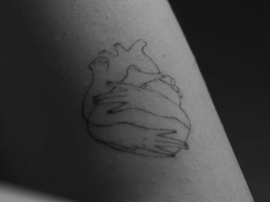 25 Fine Line Tattoo Ideas: Delicate Designs, Honestly Rated 17 Anatomical heart tattoo drawn in one weight of fine line on an inner bicep