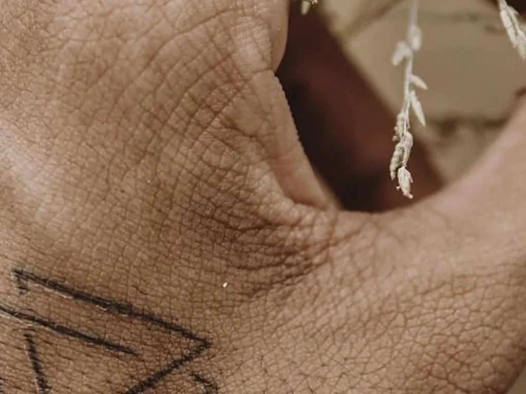 25 Fine Line Tattoo Ideas: Delicate Designs, Honestly Rated 25 Two interlocking triangles tattooed in fine line on the back of a hand