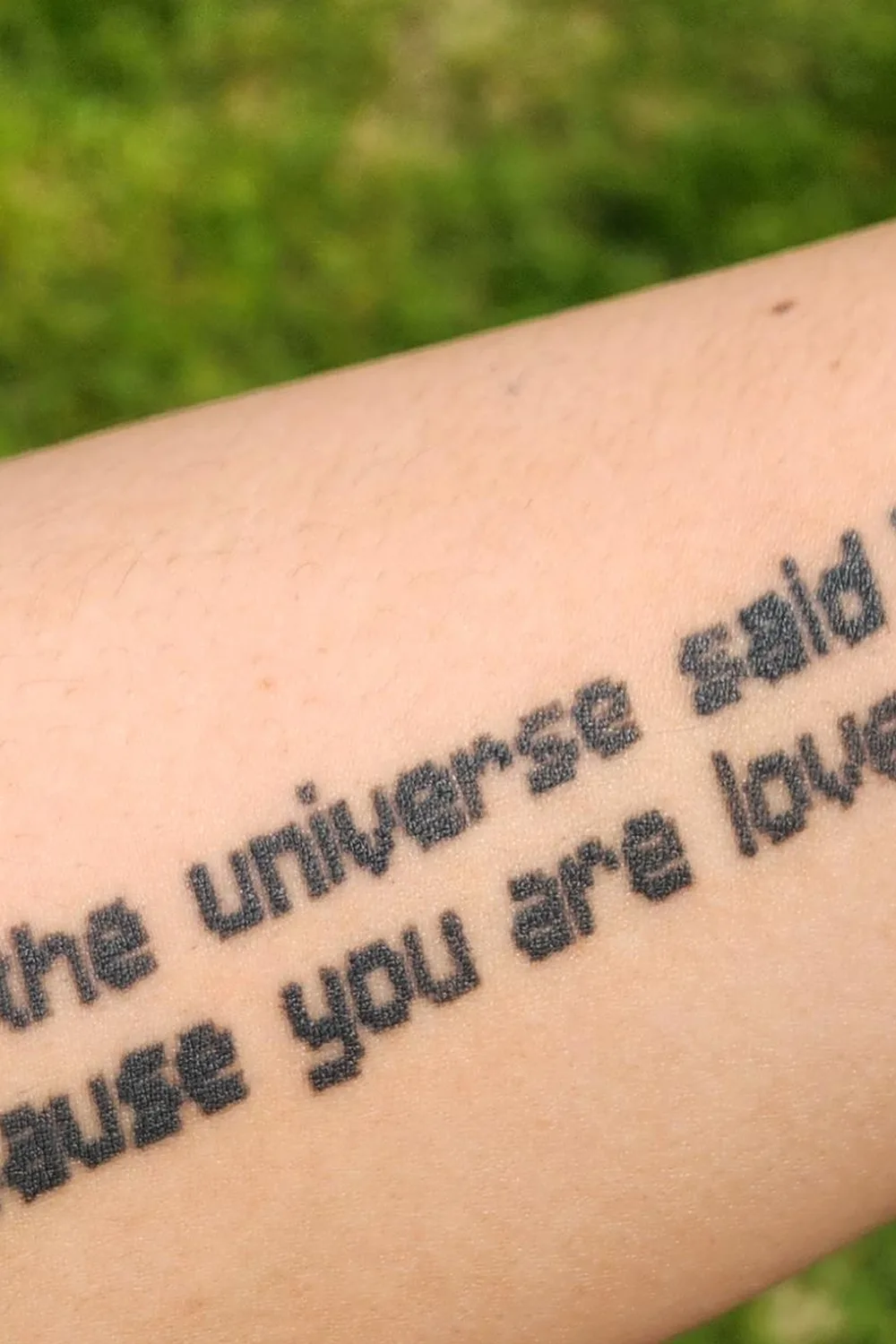 23 Small Tattoos for Women: Tiny Designs That Say a Lot, Quietly 5 Two lines of tiny typewriter-style text tattooed on the forearm