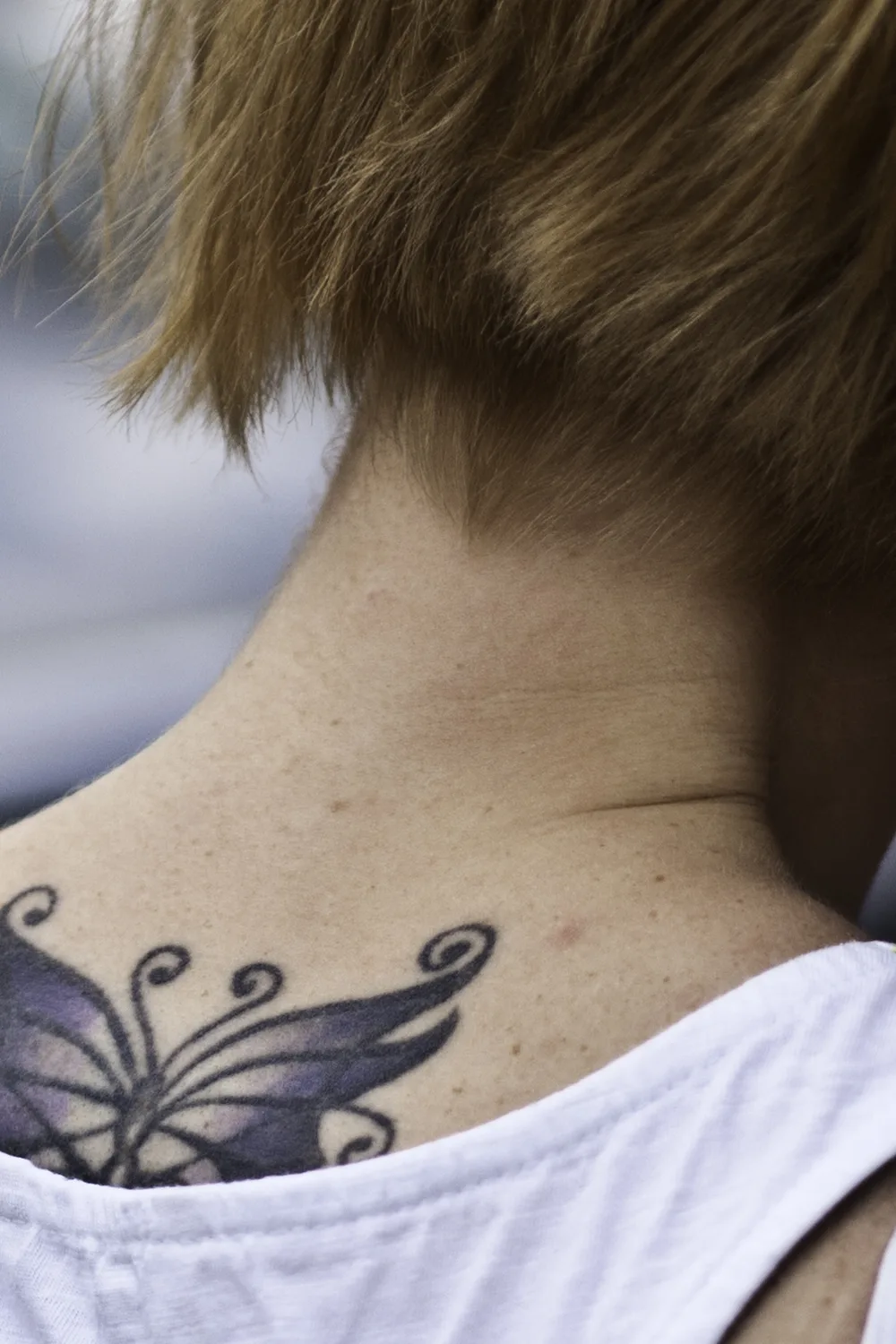 23 Small Tattoos for Women: Tiny Designs That Say a Lot, Quietly 8 Butterfly tattoo at the nape of the neck below the hairline