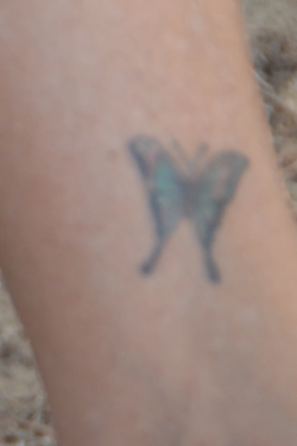 23 Small Tattoos for Women: Tiny Designs That Say a Lot, Quietly 10 Tiny faded butterfly silhouette tattoo on the inner ankle