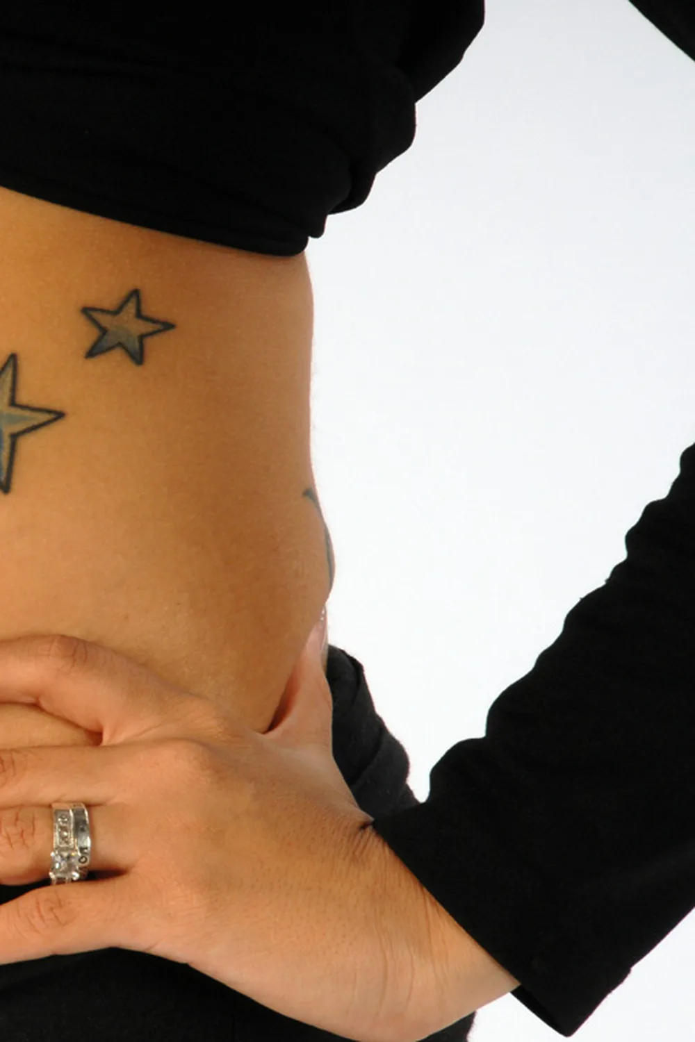 23 Small Tattoos for Women: Tiny Designs That Say a Lot, Quietly 11 Four star tattoos trailing down a woman's side