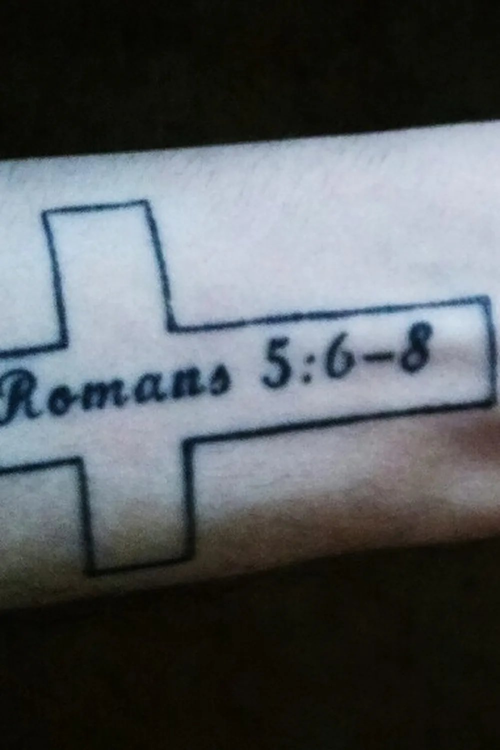 23 Small Tattoos for Women: Tiny Designs That Say a Lot, Quietly 17 Cross outline tattoo with a Bible verse reference on the wrist