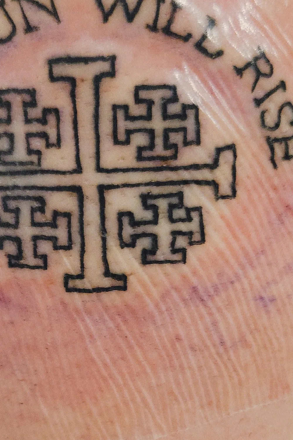 23 Small Tattoos for Women: Tiny Designs That Say a Lot, Quietly 23 Jerusalem cross tattoo with the words the sun will rise curved above it